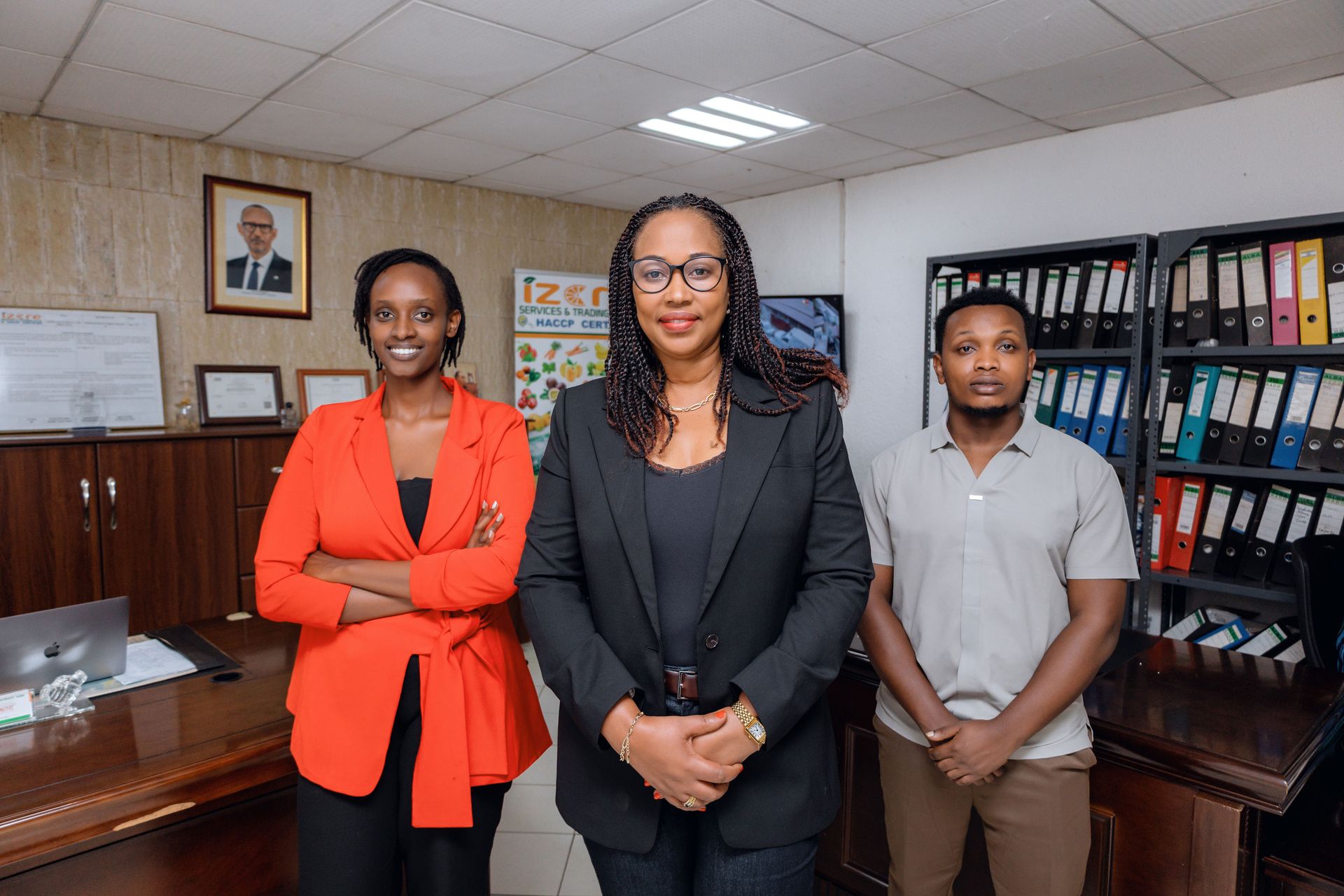 Izere Trading management team (CEO, Technical Lead, Finance) discussing strategy for fresh grocery and agro-processing operations in Kigali.